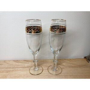 Pair of vintage champagne wine glasses with gold tone rim and design
